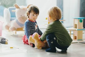 image of two children playing