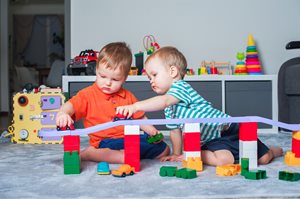 image of two children playing